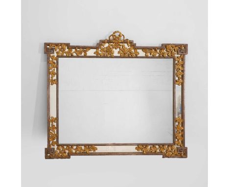 A carved and burnished giltwood wall mirror, of recent manufacture, surmounted by a ribbon, with a panelled glass slip, and p