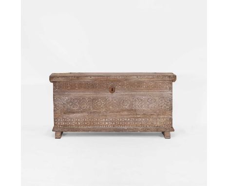 A small oak chest, 16th century, Spanish, with a carved geometric front and raised on low sledge feet,108cm wide34cm deep55cm