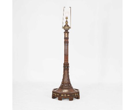 An Aesthetic oak, ebonised and gilt standard lamp, late 19th century, surmounted with a steel and brass globular reservoir, o