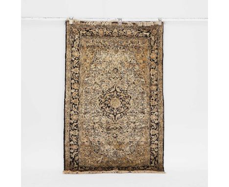 A wool rug, or recent manufacture, central Persian, the cream field with a central medallion and spandrels, within multiple f