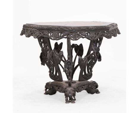 An ebony and specimen wood centre table, mid-19th century, Galle, Ceylon (Sri Lanka), the octagonal top inlaid with twenty-fo