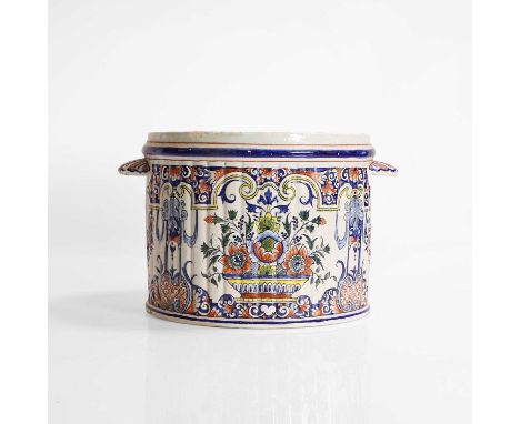A delft pot, c.1890s, Dutch, the ribbed cylindrical body polychrome-decorated with panels of flower bowls, interspersed with 