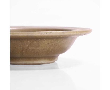 A celadon brush washer, Ming dynasty (1368-1644), Chinese, the rounded sides rising from a circular foot to an everted flat r