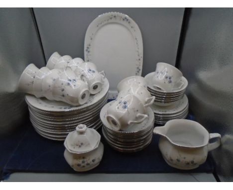 West German part dinner service, white with blue flower garlands, comprising 12 dinner plates, 6 side plates, 6 bowls, 1 serv