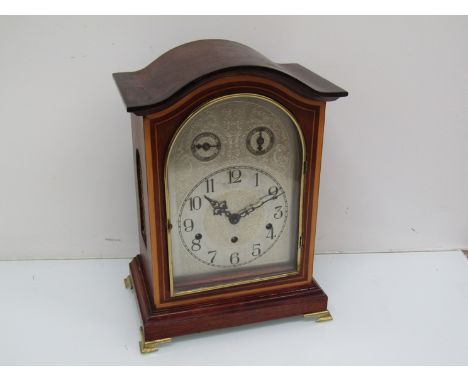 An Edwardian mahogany and satin inlaid bracket clock with silvered Arabic dial, housing a German Keinzle sriking and chiming 