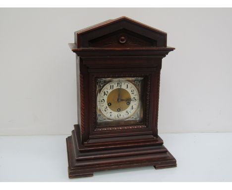 A late 19th/early 20th Century mahognay cased bracket clock of architcetural form, housing a Junghams striking and chiming th