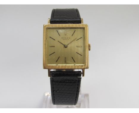ROLEX: a mid 20th Century gold cased gent's wristwatch of square form, ribbed bezel and dial, case back stamped with Rolex cr