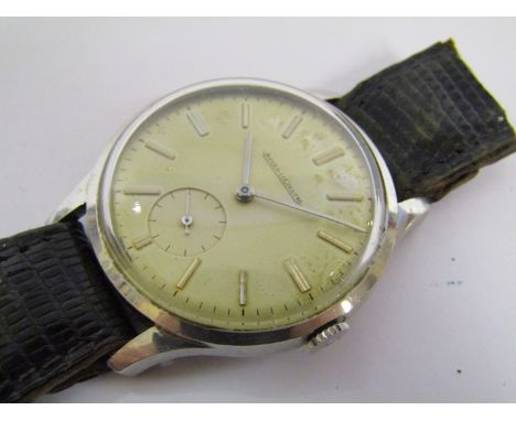 JAEGER-LECOULTRE: A mid 20th Century steel cased gents manual wind wristwatch with silvered dial and subsidiary seconds, case