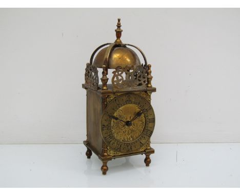 A 20th Century lantern timepiece, housing a French carriage single train patfrom movement, with key, 24.5cm high