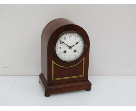 A late 19th Century mahogany dome top mantel clock with Arabic enamelled dial, French drum movement striking a gong, key and 