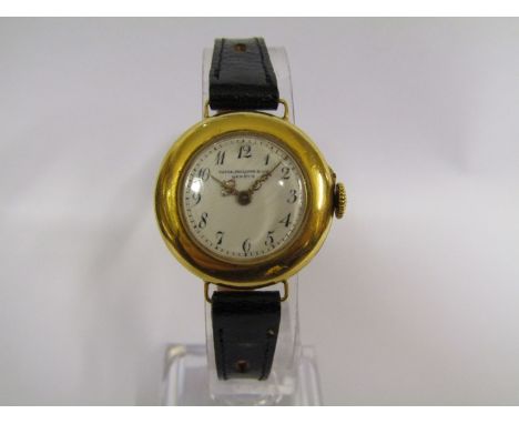 PATEK PHILIPPE: An early 20th Century 18ct gold cased lady's wristwatch with Arabic white enamelled dial and pierced gold han