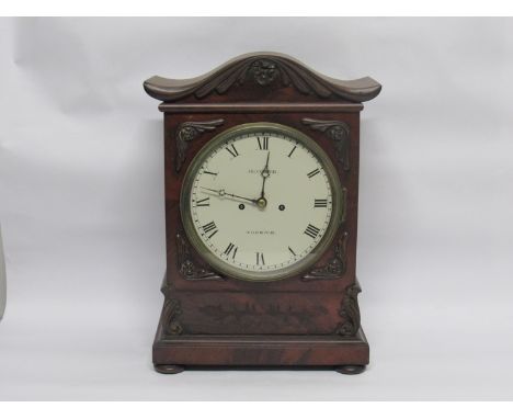 A 19th Century English flame mahogany bracket clock with painted metal Roman dial signed Jn. Cooper, Norwich, driven by an 8-