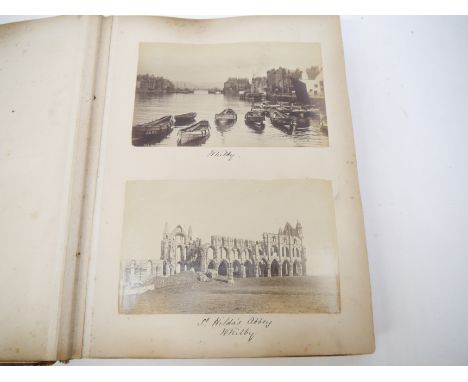 A Victorian photograph album containing over 130 mainly albumen print mounted photographs, c.1890-1894, mainly topographical 