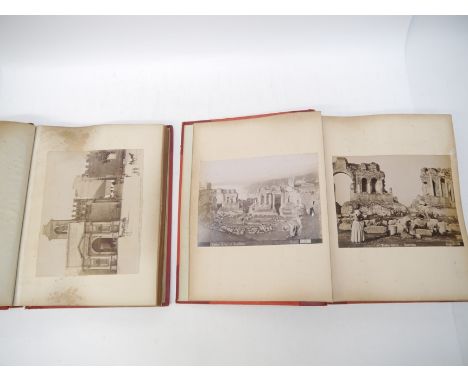 A late 19th Century photograph album containing approx 100 large mounted albumen topographical and architectural views, the v