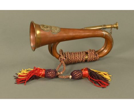 A Royal Welsh Fusiliers bugle, brass and copper.