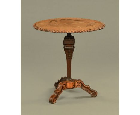 An 18th century oak tripod centre table, of architectural form with carved gadrooned border.  Height 79 cm, diameter 76 cm.