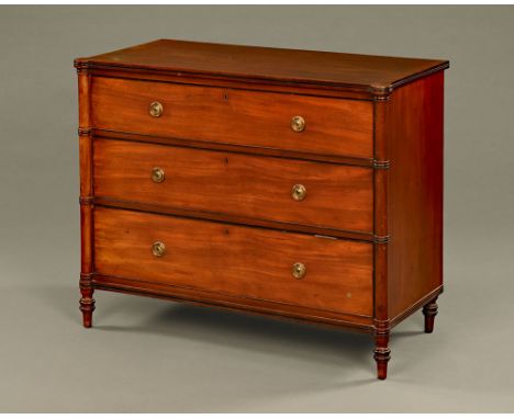 A George III mahogany chest of drawers, with ebonised cockbeading to the three drawers flanked by turret columns.  Height 85 