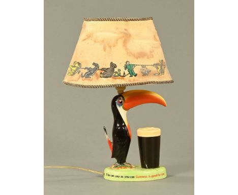 A Carltonware Toucan lamp (AF) and with original shade. CONDITION REPORT: The base has been broken into four pieces and glued