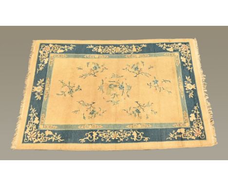 A Chinese rectangular fringed rug, with beige centre panel and three line border.  Foliate and vase patterned.  260 cm x 188 