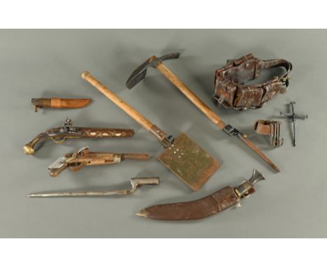 A trench tool No. 4 Mark II, together with an ammunition belt Kukri knife, two part flintlocks, a bayonet and a Campaign clot