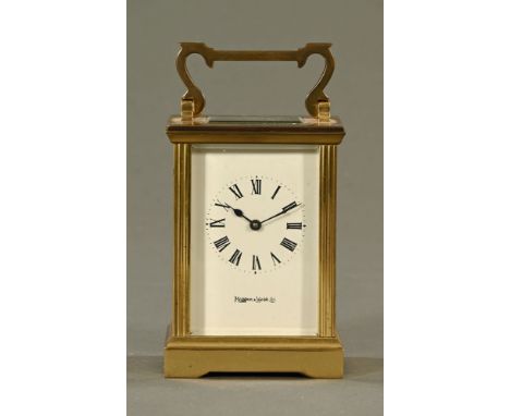 A Mappin &amp; Webb retailed brass carriage clock, timepiece only.  Height including carrying handle 15 cm (see illustration)