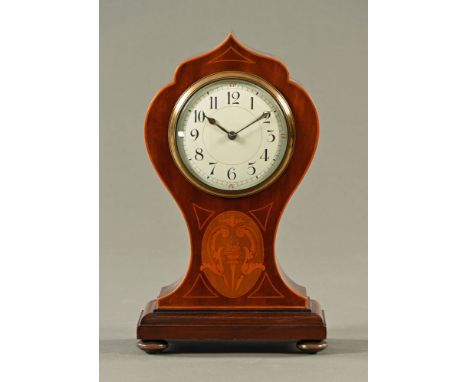 An Edwardian inlaid mahogany mantle clock, with single train movement, circular dial with Arabic numerals.  Height 25.5 cm, w
