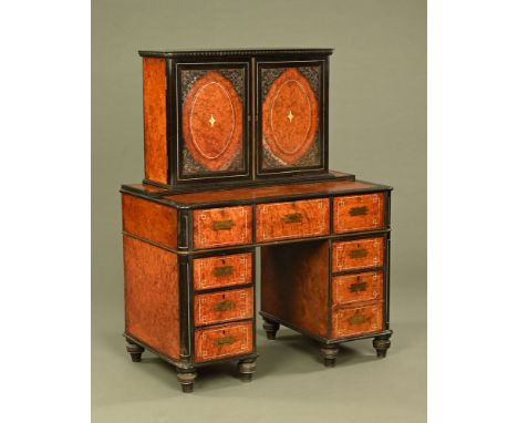 An Anglo Chinese amboyna wood military style desk, inlaid with bone and ivory,ebonised and with brass fittings, the cupboard 