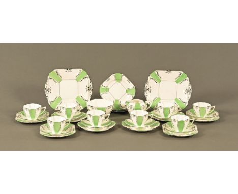 An Art Deco Shelley tea set, white, green and black, comprising 2 sandwich plates, 12 side plates, 8 saucers, 8 cups and milk