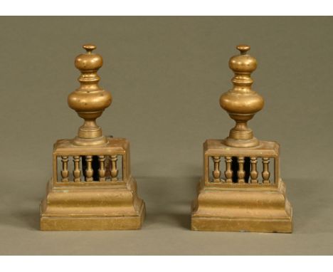 A pair of 18th/19th century Georgian brass fire dogs, of architectural baluster form with pierced gallery.  Height 29 cm, wid