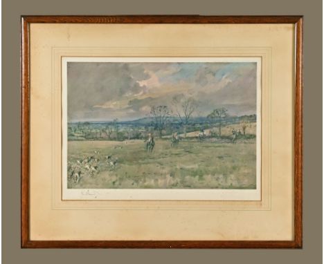 After Lionel Edwards, a signed limited edition print hunting scene.  33 cm x 49 cm in oak frame.