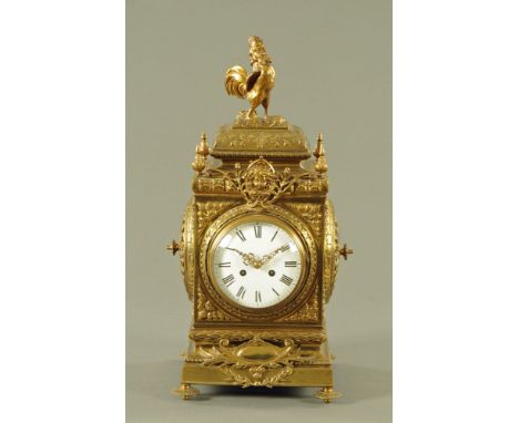 A large Victorian brass square form mantle clock, with two train movement and Roman numerals to the enamelled dial, the case 