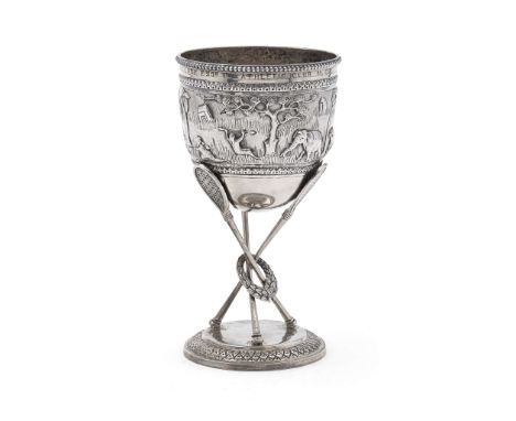  AN INDIAN PRESENTATION ‘RACKETS’ TROPHY UNMARKED The deep cup with a beaded border above and engraved inscription ‘D. C. LUS
