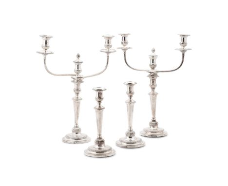  A PAIR OF GEORGE III TWIN BRANCH THREE LIGHT CANDELABRA AND TWO FURTHER CANDLESTICKS SMITH, TATE & CO., SHEFFIELD 1811 The c