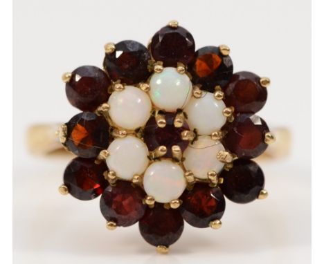 A 9ct gold opal and garnet cluster ring, diameter 17mm, P, 4.8gm 