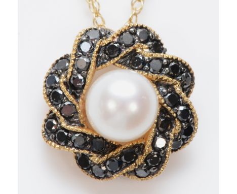 A 9ct gold, cultured pearl and enhanced black diamond cluster pendant, stated weight 0.56cts, chain, 2.7gm 