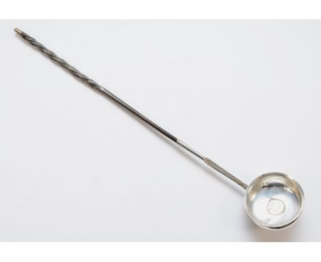 A George III silver and whalebone ladle, unmarked, the bowl inset with a 1757 silver coin, contemporary monogram, 38cm 