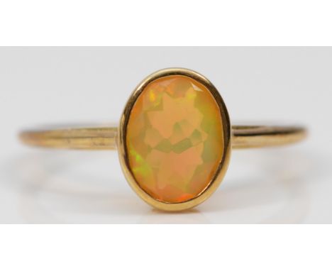 A 9ct gold and facetted water opal single stone ring, R, 2gm 