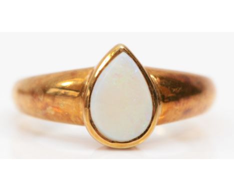 A 9ct gold ring, collet set with a pear shape opal, 9 x 6mm, N, 3.2gm 