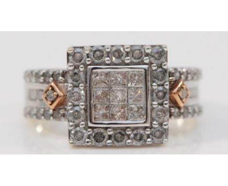 A 9ct white gold and diamond square cluster ring, set with Princess cut stones bordered by brilliants, baguette and single cu