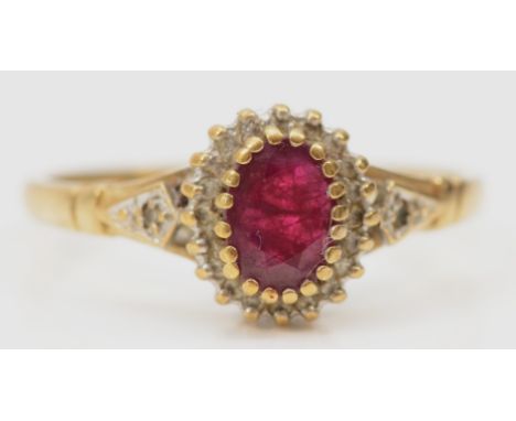 A 9ct gold ruby and diamond cluster ring, S, 2.4gm 