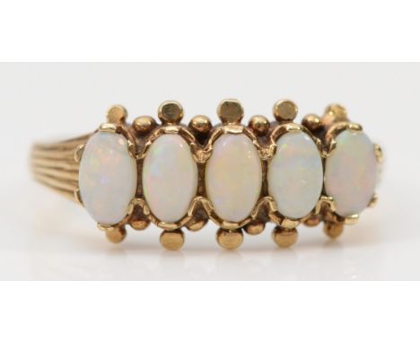 A 9ct gold opal five stone ring, P, 2.1g 