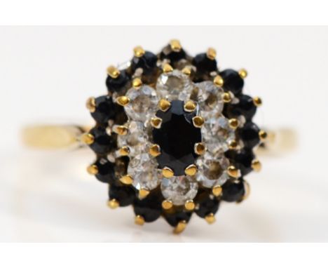 A 9ct gold sapphire and white stone cluster ring, M, 2.4gm 