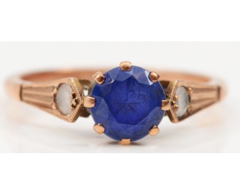 A 9ct rose gold blue and white stone ring, O, 2.4gm 