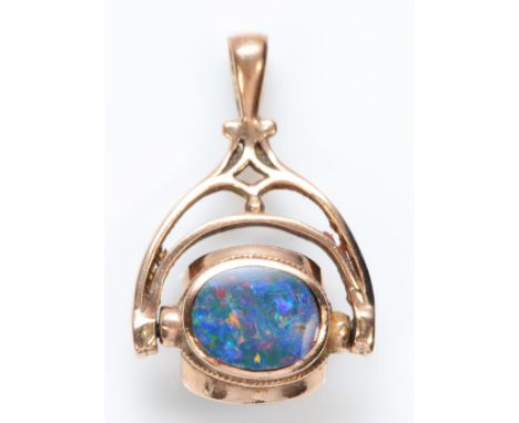 A 9ct rose gold triplet swivel seal, black opal doublet, carnelian and onyx, 26mm, 3.9gm 