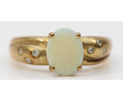 A 9ct gold opal single stone ring, brilliant cut diamond set shoulders, N, 2.5gm 