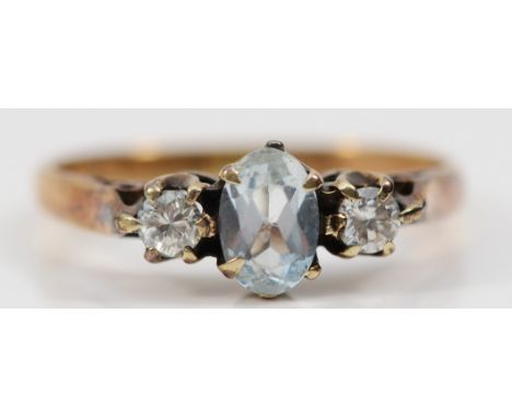 A 9ct gold aquamarine and brilliant cut diamond three stone ring, K 1/2, 1.9gm 