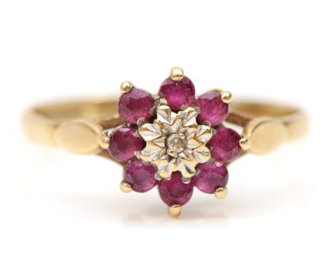 A 9ct gold ruby and diamond cluster ring, J, 1.2gm 