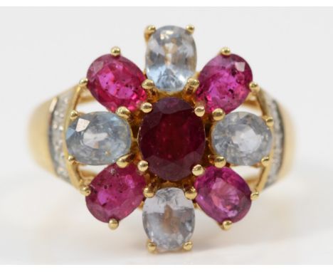 A 9ct gold ruby and aquamarine cluster ring, with brilliant cut diamond set shoulders, Q, 4.7gm 