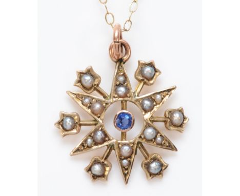 A late Victorian 9ct rose gold, blue paste and seed pearl six ray star pendant, stamped 9, 18mm, chain, 1.6gm 