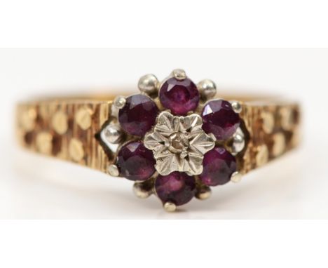 A 9ct gold ruby and diamond cluster ring, Q, 3gm 